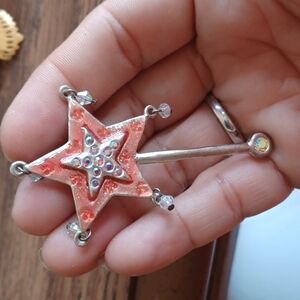 Star brooch. Silver-tone w red enamel and rhinestones,  approx 2.5" - 3"